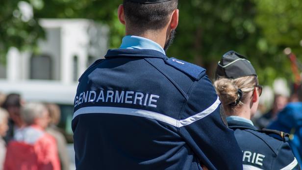 Brisach - France - 1 May 2018 - french gendarmerie patrol in lily of the valley party in the street