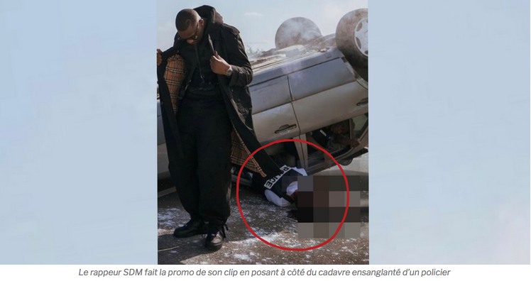 INSUPPORTABLE : Le rappeur SDM fait la promo de son clip en posant à côté du cadavre d’un policier